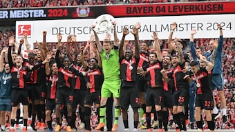 Bayer Leverkusen celebrated the Bundesliga title after going unbeaten throughout - a Bundesliga record. AP