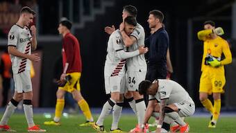 Leverkusen's head coach Xabi Alonso, right, congratulates his players at the end of the Europa League semifinal first leg match against Roma. AP