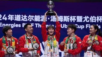 China's Chen Yu Fei holds up the Uber Cup after leading Team China 3-0 to win over Team Indonesia in the final on Sunday. AP 