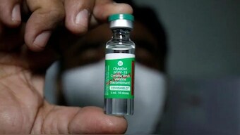 A vial of Covishield manufactured by the Serum Institute of India being displayed by an official. Source: FILE/REUTERS.