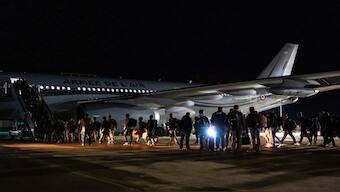 This handout photo provided by the French Army shows security force embarking a plane to New Caledonia at the Istres military base, southern France. AP File