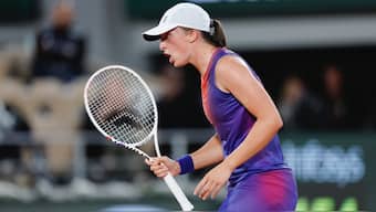 Iga Swiatek came from the brink to beat Naomi Osaka in the second round of the French Open at Roland Garros in Paris. AP