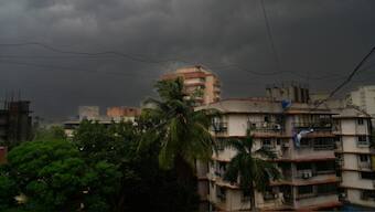 Dark clouds hang over during a pre-monsoon thunderstorm accompanied by strong winds and rain in Mumbai, India, Monday, 13 May 2024. AP