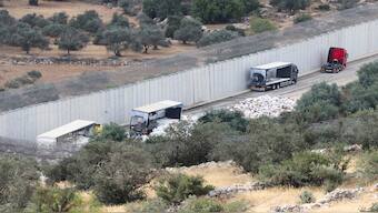 A view of trucks carrying aid to Gaza that were stopped after they were damaged by Israeli settlers near a checkpoint near Hebron in the Israeli-occupied West Bank. Reuters