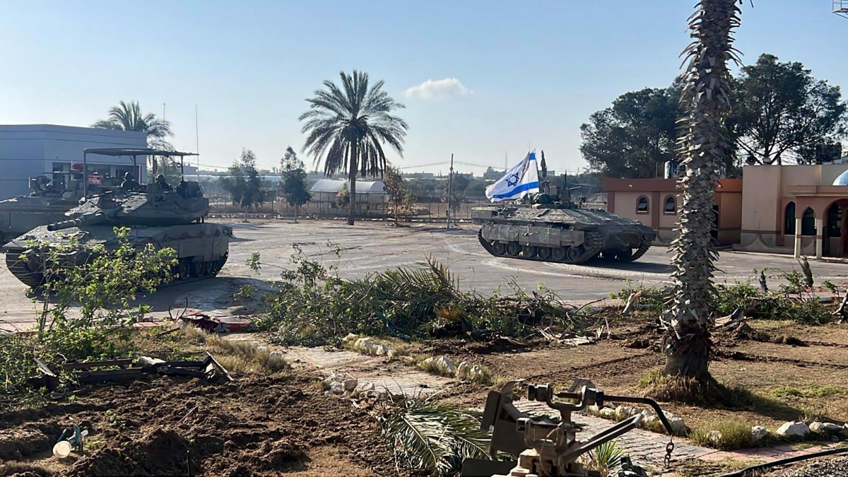 This photo provided by the Israel Defense Forces shows a tank with an Israel flag on it entering the Gazan side of the Rafah border crossing on May 7, 2024. Israel Defense Forces via AP This photo provided by the Israel Defense Forces shows a tank with an Israel flag on it entering the Gazan side of the Rafah border crossing on May 7, 2024. Israel Defense Forces via AP