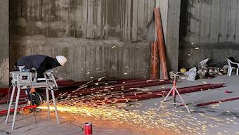 A worker uses a buzz saw at the construction site for a new warehouse in the Har Tuv Industrial Zone in Beit Shemesh, Israel. Reuters File