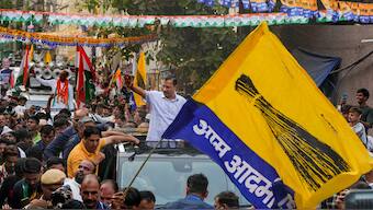 Delhi Chief Minister Arvind Kejriwal waves to supporters during a roadshow for Lok Sabha polls, in New Delhi on 15 May, 2024. PTI