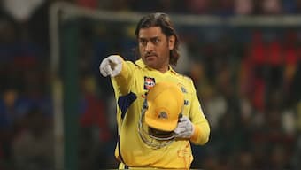 Chennai Super Kings' MS Dhoni places field during the Indian Premier League match against Royal Challengers Bengaluru in Bengaluru. AP