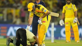 Watch: MS Dhoni comes to pitch invader's rescue for touching his feet