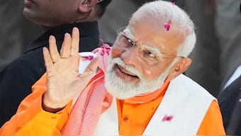 Prime Minister Narendra Modi during a road show for Lok Sabha elections, in Varanasi on 13 May, 2024. PTI