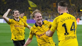 Dortmund's Niclas Fuellkrug, right, celebrates after scoring the winner against Paris Saint-Germain. AP