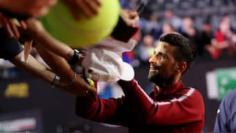 A bottle fell on the back of Novak Djokovic's head while the Serbian tennis superstar was signing autographs following his second-round victory in the Italian Open. Reuters
