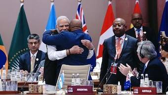 PM Narendra Modi greeted African Union President Comoros Azali Assoumani with a hug before the G20 leaders began their deliberations at the G20 India Summit in 2023. Image:  Twitter/@g20org
