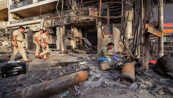 A forensic expert collects samples from site of the fire at the New Born Baby Care Hospital, in east Delhi, Sunday, 26 May 2024. PTI
