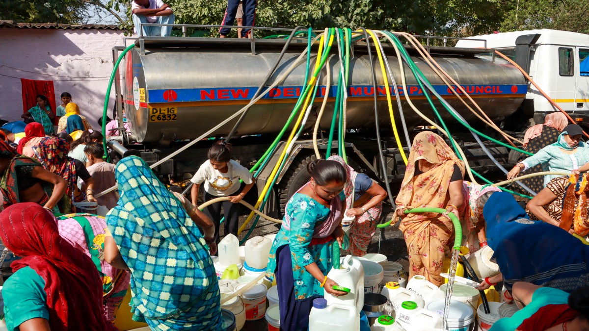 People collect drinking water from a tanker on a hot summer day, at Vivekanand camp, in New Delhi,on 28 May 2024. PTI File People collect drinking water from a tanker on a hot summer day, at Vivekanand camp, in New Delhi,on 28 May 2024. PTI File