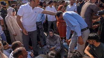 Jammu and Kashmir Peoples Democratic Party(PDP) President Mehbooba Mufti, center, blocks a road with her supporters as she protests against the alleged detention of her party workers ahead of the sixth round of polling in India's national election in Bijehara, south of Srinagar, Indian controlled Kashmir, Saturday, May 25, 2024.- AP