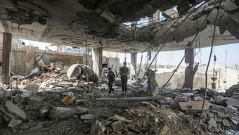 Palestinians stand in the ruins of the Chahine family home, after an overnight Israeli strike that killed at least two adults and five boys and girls under the age of 16 in Rafah, southern Gaza Strip, Friday, May 3, 2024.- AP