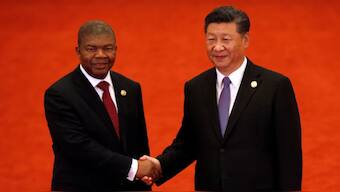 Angola's President Joao Lourenco, left, shakes hands with Chinese President Xi Jinping- Reuters