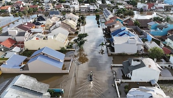 A boat navigates through a flooded street after heavy rain in Canoas, Rio Grande do Sul state, Brazil, Wednesday, May 8, 2024.- AP