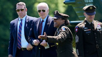 President Joe Biden, from second left, is greeted by Col. Tasha Lowrey, Joint Base Myer–Henderson Hall commander, and Command Sergeant Maj. Michael Fisheras, as he walks off of Marine One at Fort Lesley J. McNair in Washington, as he returns from a weekend in Delaware, Monday, May 13, 2024.- AP