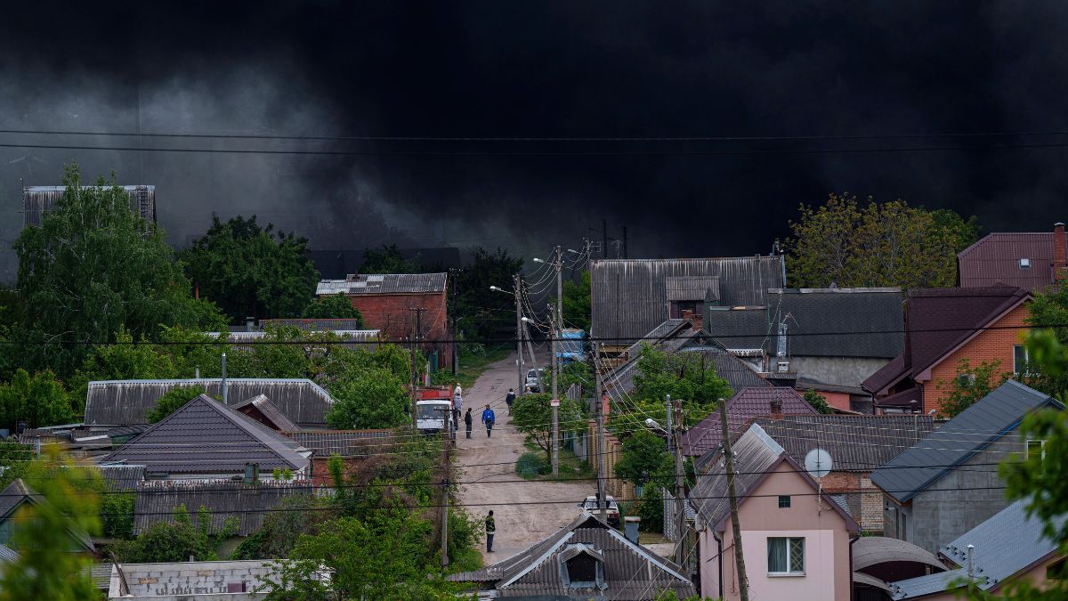People walk on a street while smoke rises after a Russian attack in Kharkiv, Ukraine, Friday, May 17, 2024. File image/AP People walk on a street while smoke rises after a Russian attack in Kharkiv, Ukraine, Friday, May 17, 2024. File image/AP