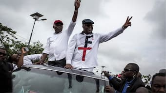 Congolese main opposition figures, leader of the Union for Democracy and Social Progress (UDPS) Felix Tshisekedi (R) and his running mate leader of the Union for the Congolese Nation (Union pour la Nation Congolaise, UNC) Vital Kamerhe(L) wave from a car to their supporters after arriving in Kinshasa on November 27, 2018. - File Photo- AFP