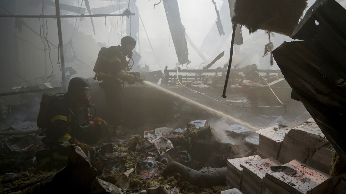 Firefighters hose down a fire as a lifeless body lies under the rubble after a Russian missile hit a large printing house in Kharkiv, Ukraine, Thursday, May 23, 2024. - AP Firefighters hose down a fire as a lifeless body lies under the rubble after a Russian missile hit a large printing house in Kharkiv, Ukraine, Thursday, May 23, 2024. - AP