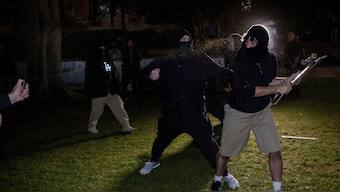 Demonstrators clash at a pro-Palestinian encampment at UCLA late Tuesday, April 30, 2024, in Los Angeles. Dueling groups of protesters have clashed at the University of California, Los Angeles, grappling in fistfights and shoving, kicking and using sticks to beat one another. - AP