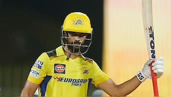 Chennai Super Kings captain Ruturaj Gaikwad raises his bat in celebration after completing his half-century against Punjab Kings in Chennai. AP