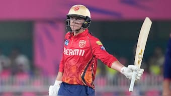 Punjab Kings captain Sam Curran celebrates after completing his half-century against Rajasthan Royals in Guwahati. AP