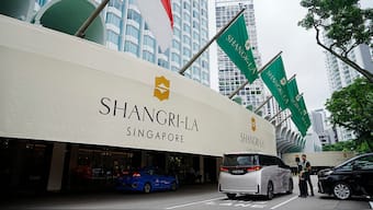 Police officers guard near the entrance of the Shangri-La Hotel, the venue for the 21th International Institute for Strategic Studies (IISS) Shangri-La Dialogue, Asia's annual defence and security forum, in Singapore. AP