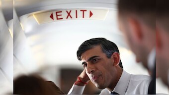 British Prime Minister Rishi Sunak talks to journalists on his plane as he travels from Northern Ireland to Birmingham during a day of campaigning on 24 May, 2024. AP