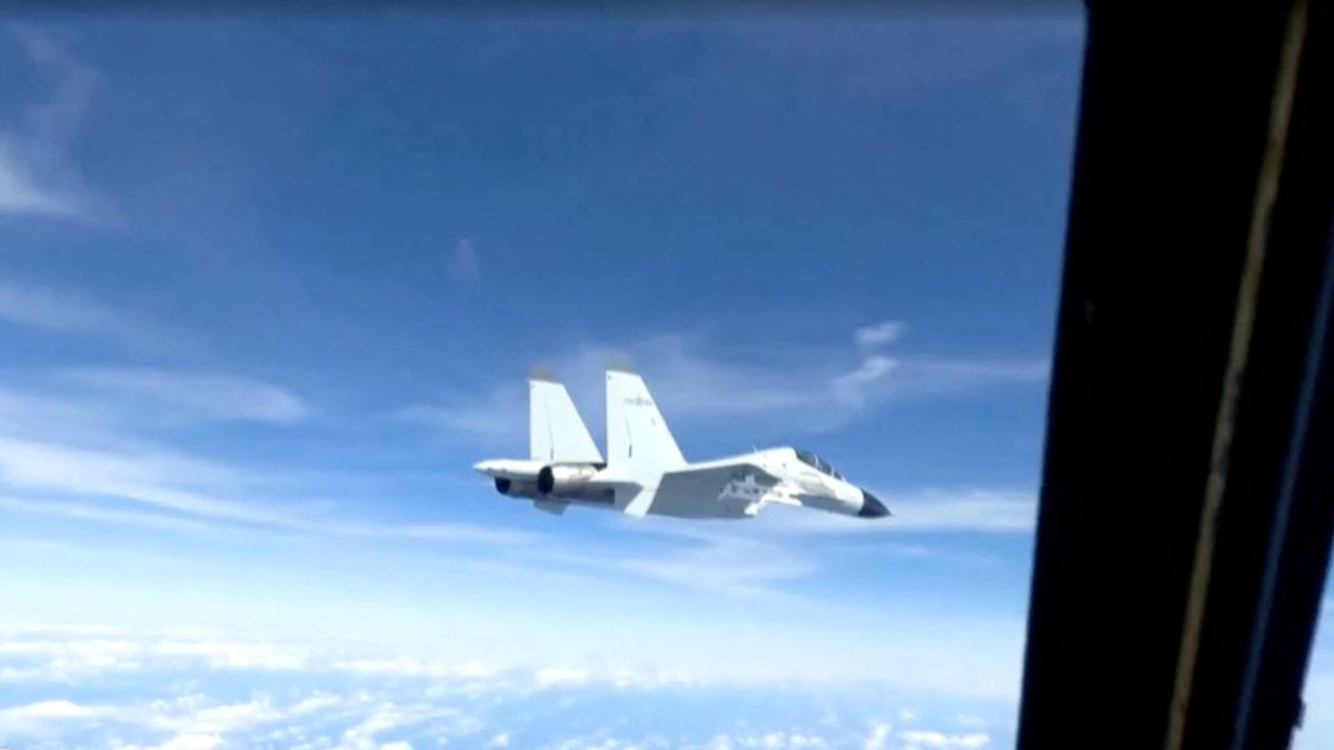 Chinese fighter jet accused of getting in the way of an Australian navy helicopter in yellow sea Chinese fighter jet accused of getting in the way of an Australian navy helicopter in yellow sea