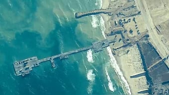 US and Israeli militaries put temporary pier to deliver humanitarian aid on the Gaza coast. Reuters