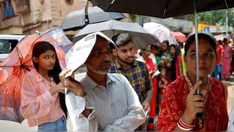 Parents waiting outside schools to pick up their wards after bomb threat. File Photo