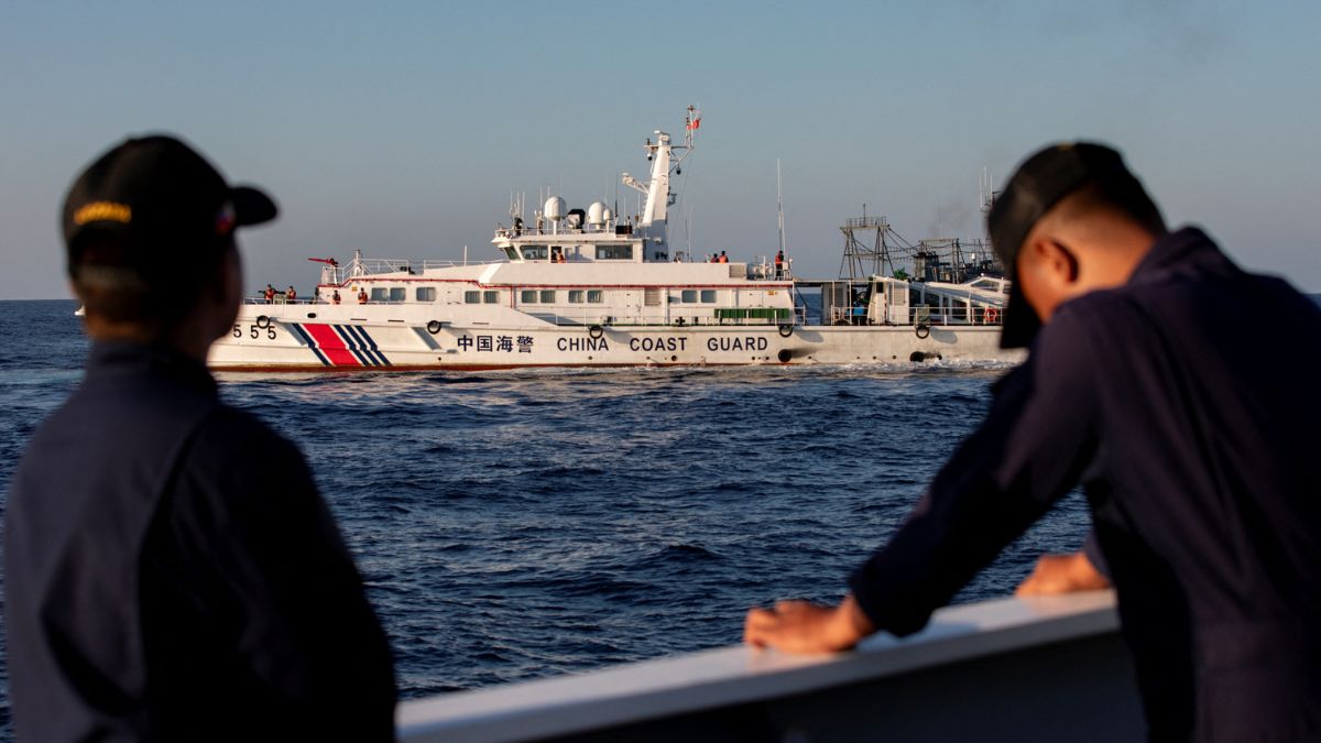 Members of the Philippine Coast Guard stand alert as a Chinese Coast Guard vessel blocks their way to a resupply mission at Second Thomas Shoal in the South China Sea. Reuters file/Representative image Members of the Philippine Coast Guard stand alert as a Chinese Coast Guard vessel blocks their way to a resupply mission at Second Thomas Shoal in the South China Sea. Reuters file/Representative image