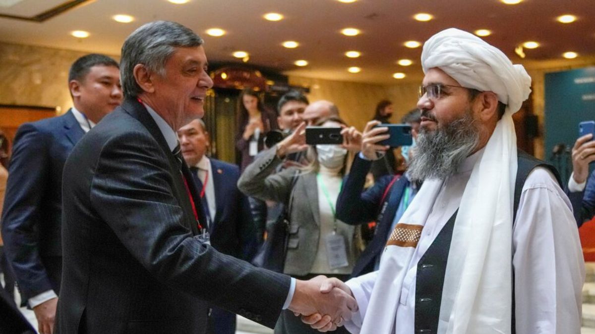 Russian presidential envoy to Afghanistan Zamir Kabulov shakes hands with a representative of the Taliban delegation Mawlawi Shahabuddin Dilawar before the beginning of international talks on Afghanistan in Moscow, Russia, October 20, 2021. Alexander Zemlianichenko/Pool via REUTERS Russian presidential envoy to Afghanistan Zamir Kabulov shakes hands with a representative of the Taliban delegation Mawlawi Shahabuddin Dilawar before the beginning of international talks on Afghanistan in Moscow, Russia, October 20, 2021. Alexander Zemlianichenko/Pool via REUTERS