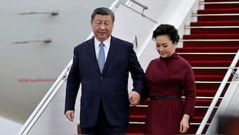 (File) China's President Xi Jinping holds the hand of his wife Peng Liyuan as they disembark from their aeroplane upon their arrival for an official two-day state visit, at Orly airport, south of Paris, France on 5 May 2024. Reuters