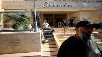 A man manoeuvres media equipment following an Israeli police raid on an Al Jazeera de facto office at the Ambassador Hotel in Jerusalem. Reuters