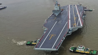 China's third aircraft carrier, the Fujian, prepares to set out for maiden sea trials from Shanghai Jiangnan Shipyard in eastern China's Shanghai. AP