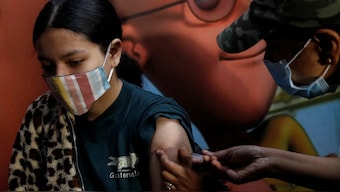 A girl receives a dose of the Covaxin coronavirus disease vaccine manufactured by Bharat Biotech, during a vaccination drive in New Delhi. File photo/Reuters