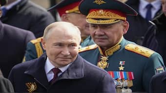 Russian President Vladimir Putin, left, and Russian Defense Minister Sergei Shoigu leave Red Square after the Victory Day military parade in Moscow. Source: File Image / AP