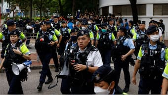 Police stand guard outside the West Kowloon Magistrates' Courts building during the verdict of the 47 pro-democracy activists charged under the national security law, in Hong Kong, China, 30 May, 2024. Reuters