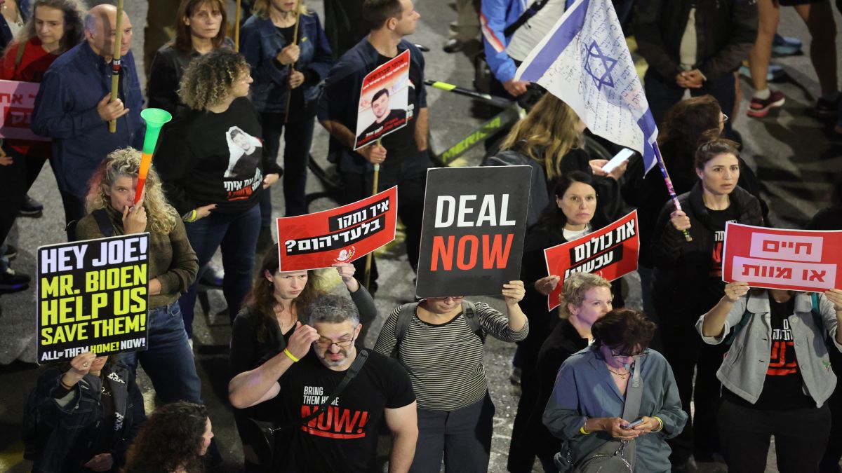 Relatives and supporters of hostages taken captive by Hamas in Gaza during the 7 October attacks, hold placards and wave national flags during a demonstration calling for their release, in the Israeli coastal city of Tel Aviv. AFP Relatives and supporters of hostages taken captive by Hamas in Gaza during the 7 October attacks, hold placards and wave national flags during a demonstration calling for their release, in the Israeli coastal city of Tel Aviv. AFP
