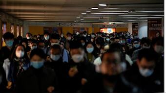 People wearing face masks walk in a subway station, as coronavirus disease (COVID-19) outbreaks continue in Shanghai, China, 8 December, 2022. Reuters