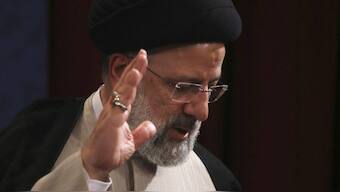 In this June 21, 2021, photo, Iran's new President-elect Ebrahim Raisi waves at the conclusion of his news conference in Tehran, Iran. Biden administration officials are insisting that the election of a hard-liner as Iran’s president won’t affect prospects for reviving the faltering 2015 nuclear deal with Tehran. But there are already signs that their goal of locking in a deal just got harder. (AP Photo/Vahid Salemi)