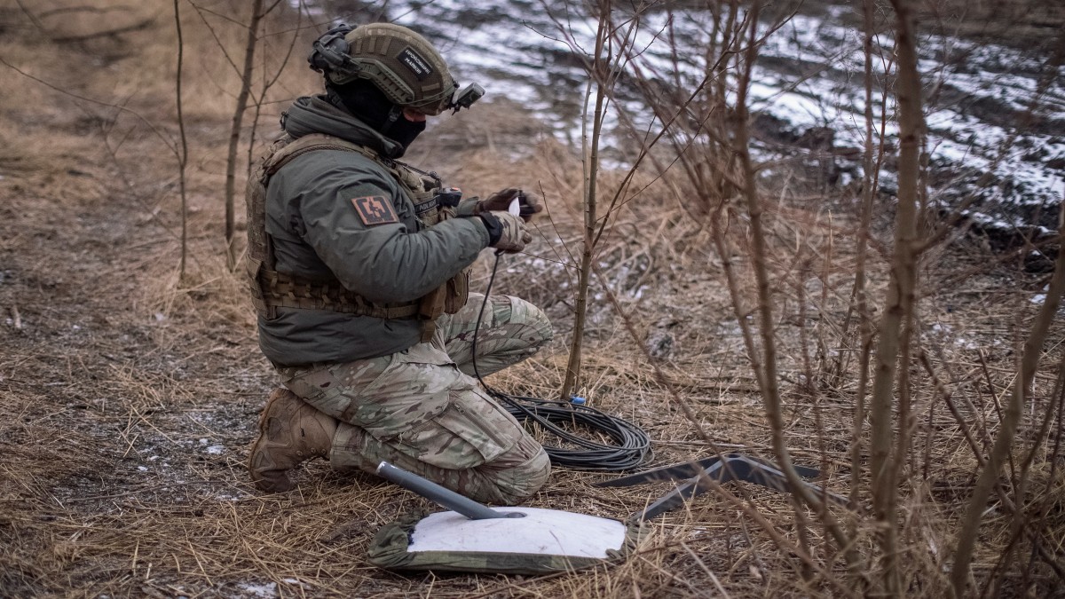 A Ukrainian serviceman of 47th brigade prepares a Starlink satellite internet systems at his positions at a front line. Image: REUTERS A Ukrainian serviceman of 47th brigade prepares a Starlink satellite internet systems at his positions at a front line. Image: REUTERS