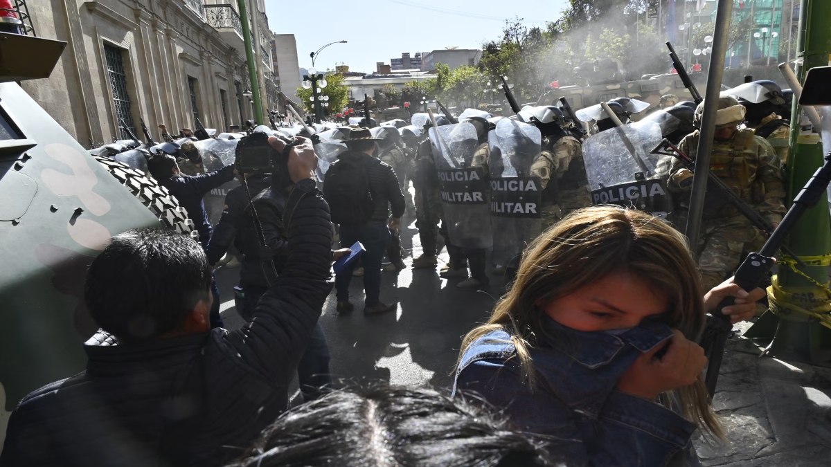 Bolivian troops used tear gas and clashed with the country's police as the march towards the capital. AFP Bolivian troops used tear gas and clashed with the country's police as the march towards the capital. AFP