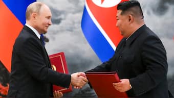 Russian President Vladimir Putin, left, and North Korea's leader Kim Jong Un shake hands after a signing ceremony of the new partnership in Pyongyang, North Korea, on Wednesday, 19 June 2024.