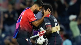 United States' Muhammad Ali-Khan, left, congratulates teammate Aaron Jones following the victory over Canada in the men's T20 World Cup cricket match. AP